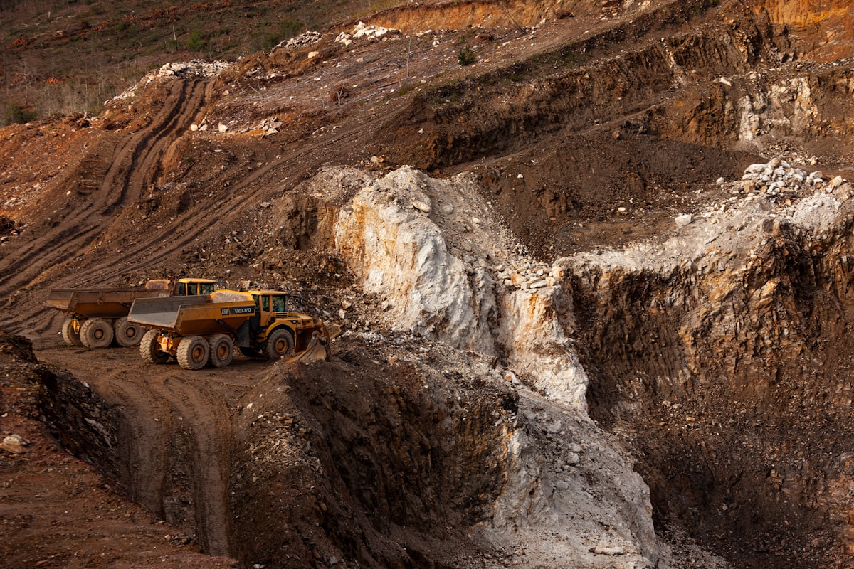 Haul trucks working the benches of an open-pit mine